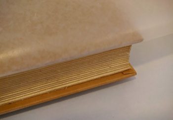 When gluing the pages together put wax paper between the cover and pages.